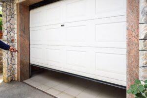 bigstock Garage Door Pvc Hand Use Remo 282680386 scaled