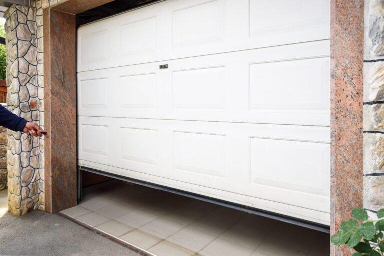 bigstock Garage Door Pvc Hand Use Remo 282680386 scaled